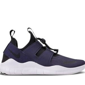 Nike Women’s Free Commuter  running slip on black/ blue running shoes. Size 8.5
